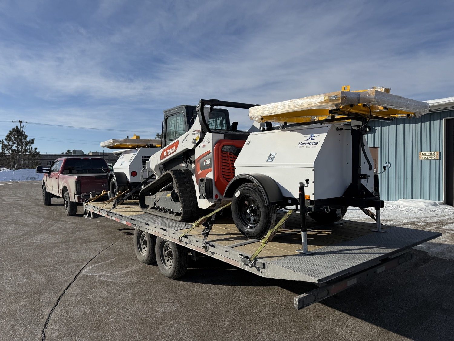 Equipment on a deck-over trailer